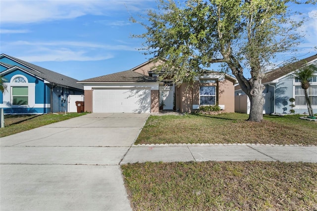 ranch-style home with a garage and a front lawn