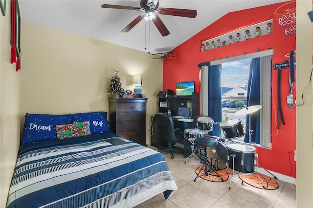 tiled bedroom with ceiling fan and lofted ceiling