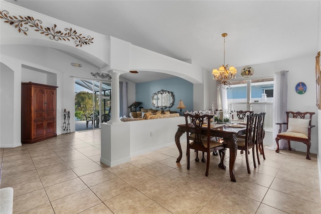 tiled dining space with ornate columns and an inviting chandelier