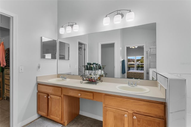 bathroom with tile patterned flooring and vanity