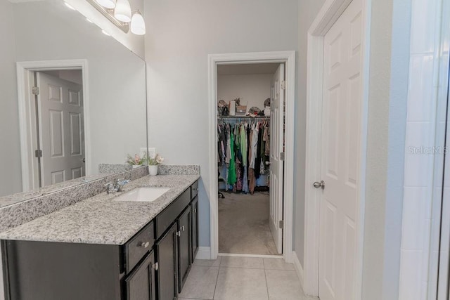 bathroom with vanity and tile patterned flooring