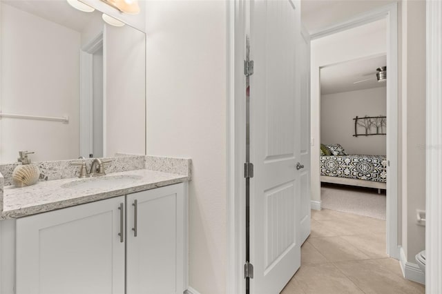 bathroom with tile patterned floors and vanity