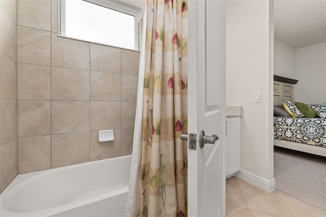 bathroom with tile patterned flooring, shower / tub combo, and vanity