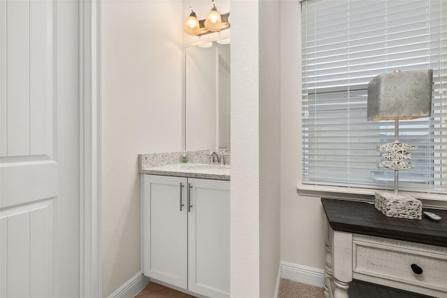 bathroom with tile patterned floors and vanity