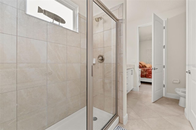 bathroom with tile patterned floors, toilet, and walk in shower