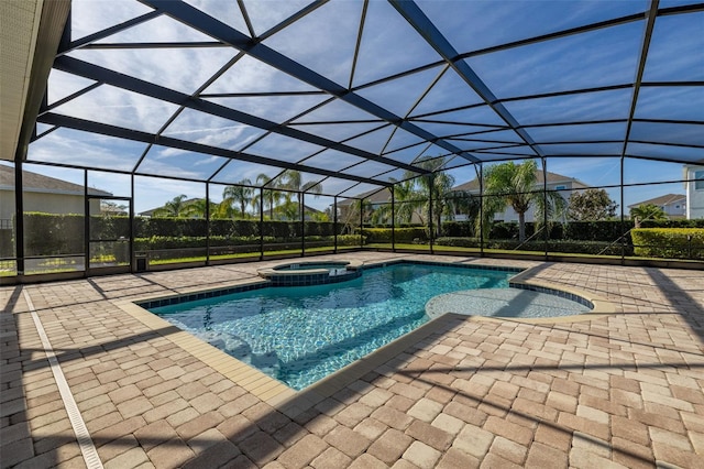 view of swimming pool with a lanai, a patio, and an in ground hot tub