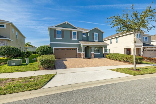 view of front facade with a front yard and a garage