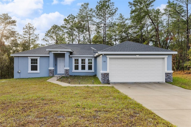 view of front facade featuring a garage and a front lawn