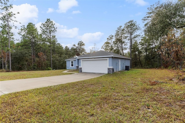 exterior space with a garage and a front lawn