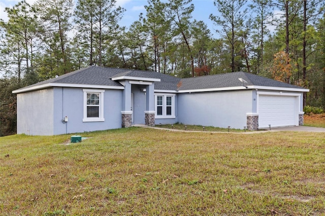 view of front of house with a garage and a front lawn