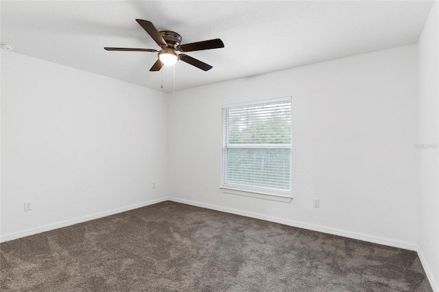 carpeted empty room with ceiling fan