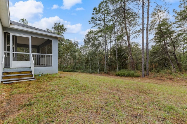 view of yard with a sunroom