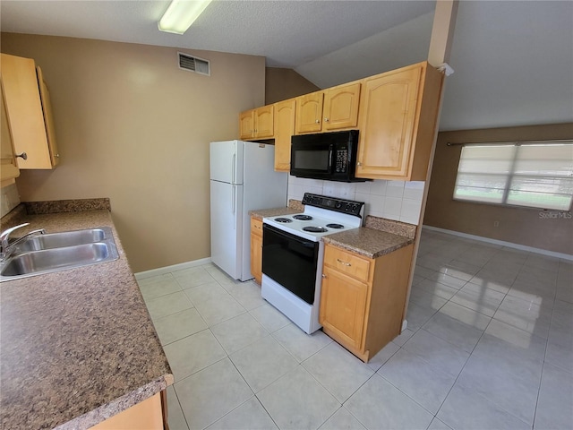 kitchen featuring sink, light brown cabinets, vaulted ceiling, white appliances, and light tile patterned flooring