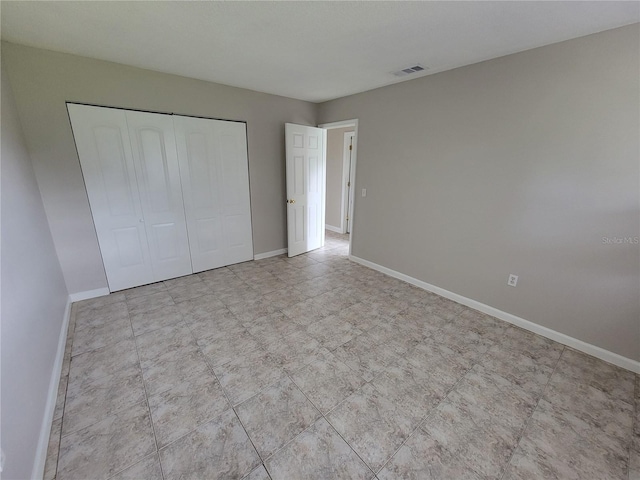 unfurnished bedroom featuring a closet