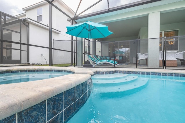 view of pool featuring pool water feature, a patio area, and a hot tub