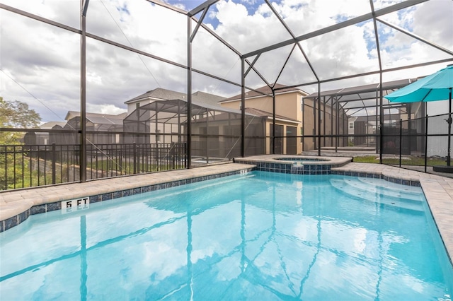 view of swimming pool with an in ground hot tub and glass enclosure