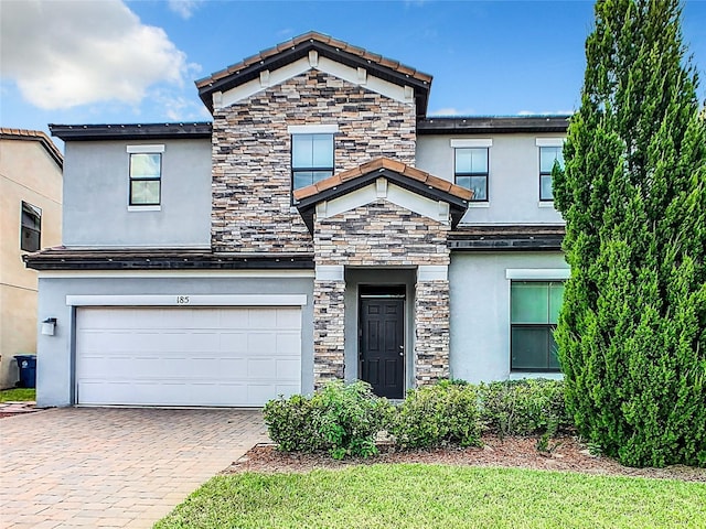 view of front of property with a garage