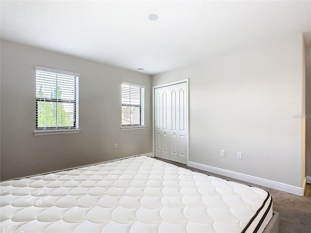 unfurnished bedroom featuring a closet