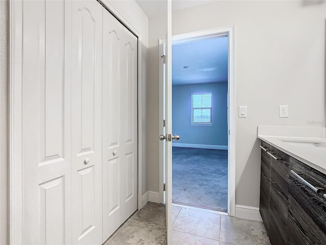 bathroom featuring tile patterned floors and vanity