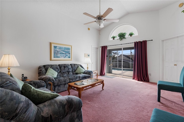 carpeted living room featuring ceiling fan, high vaulted ceiling, and a textured ceiling