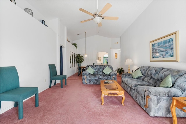 carpeted living room with ceiling fan and high vaulted ceiling