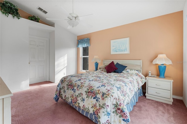 bedroom featuring ceiling fan, light colored carpet, and vaulted ceiling