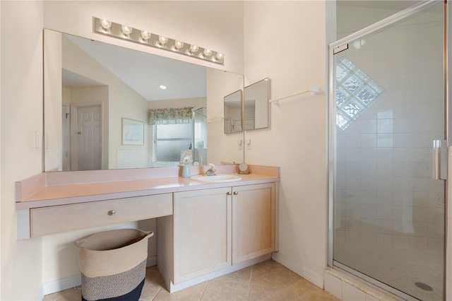 bathroom featuring tile patterned floors, vanity, and walk in shower