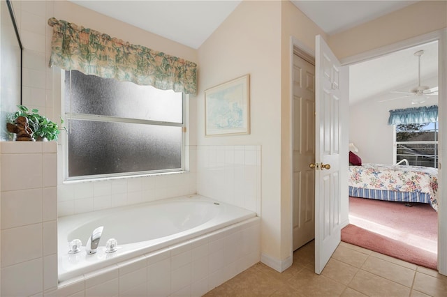 bathroom featuring tile patterned floors, a wealth of natural light, lofted ceiling, and ceiling fan