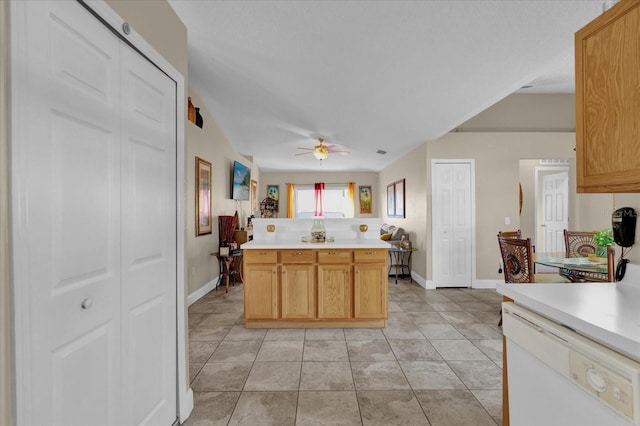 kitchen with ceiling fan, light brown cabinetry, white dishwasher, and light tile patterned floors