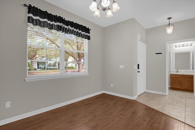 interior space with an inviting chandelier and light tile patterned flooring