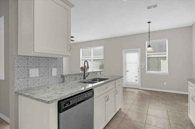 kitchen featuring sink, dishwasher, light stone counters, and white cabinetry