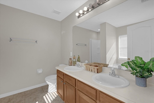 full bath with tile patterned flooring, visible vents, double vanity, and a sink