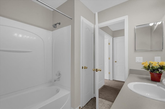 bathroom with tile patterned floors, bathtub / shower combination, and vanity