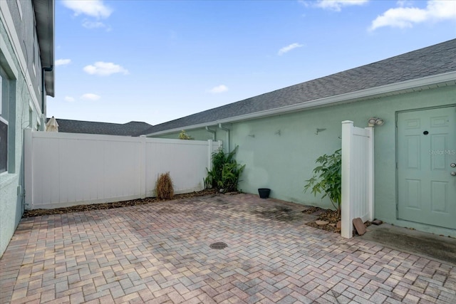 view of patio / terrace featuring fence