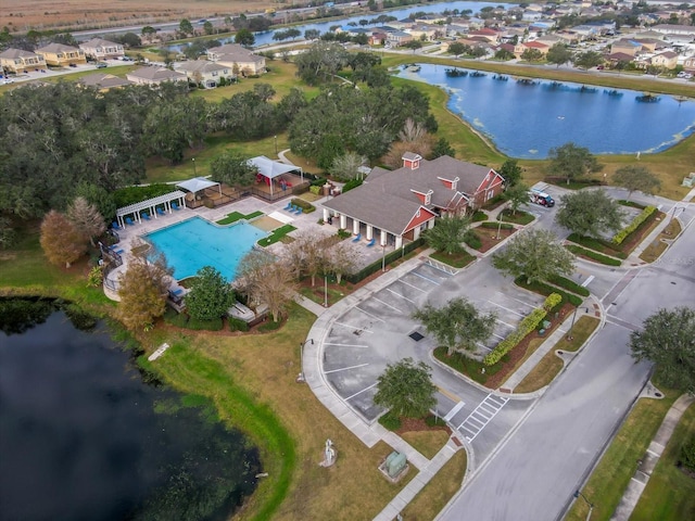 aerial view with a residential view and a water view