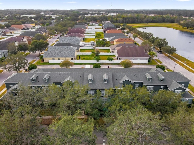 drone / aerial view with a residential view and a water view