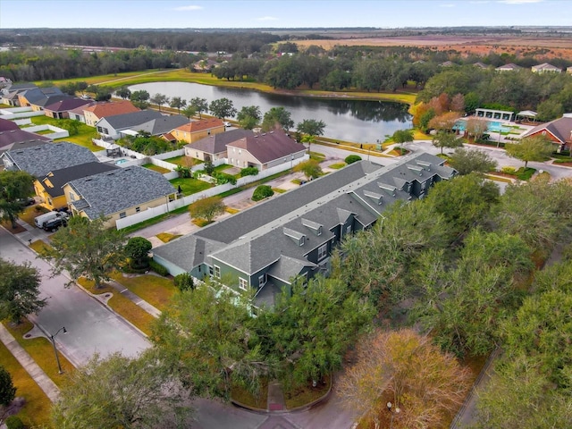 birds eye view of property featuring a residential view and a water view