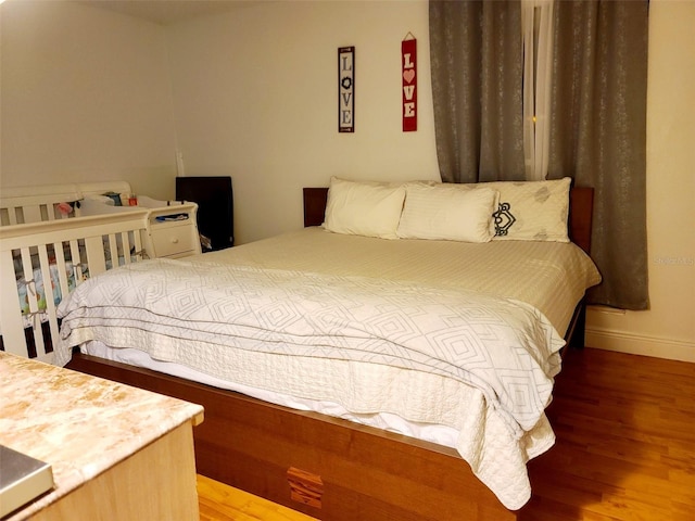 bedroom featuring hardwood / wood-style floors