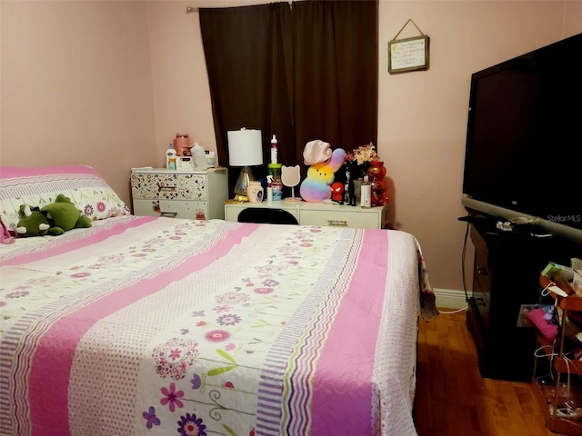 bedroom featuring hardwood / wood-style flooring