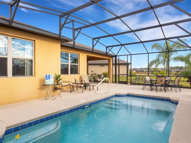 view of swimming pool featuring a patio and glass enclosure