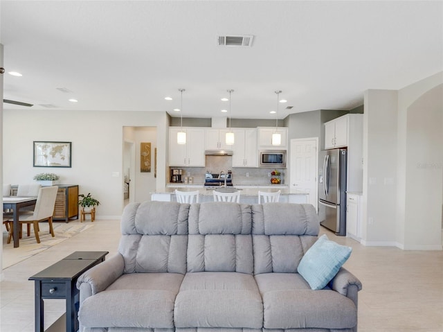 living room featuring sink