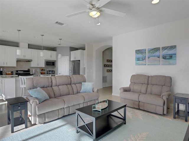 living room with ceiling fan