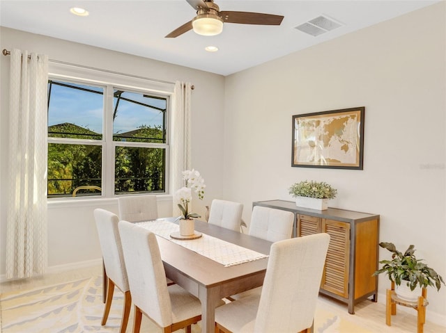 dining area with a wealth of natural light and ceiling fan