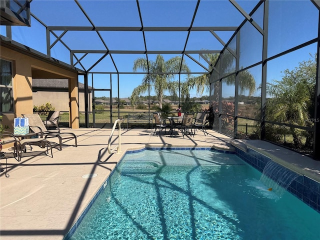 view of swimming pool with a lanai, a patio, and pool water feature