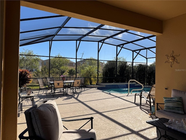 view of patio featuring a lanai