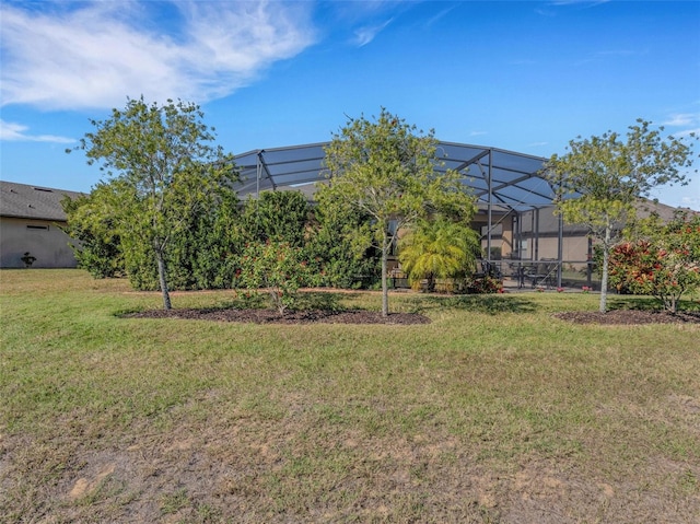 view of yard featuring glass enclosure