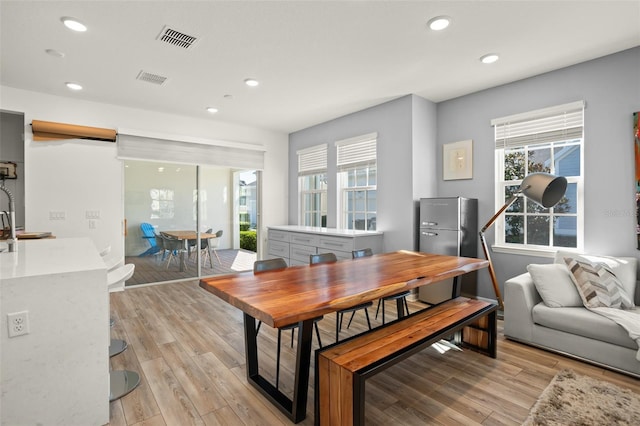 dining room featuring light hardwood / wood-style floors