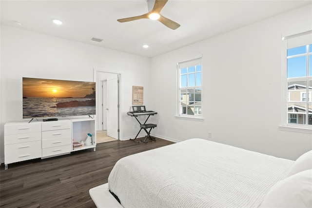 bedroom featuring ceiling fan and dark hardwood / wood-style flooring