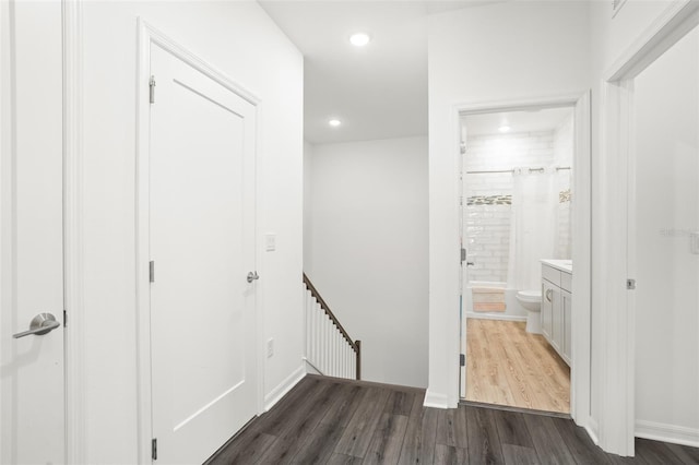 hallway featuring dark wood-type flooring