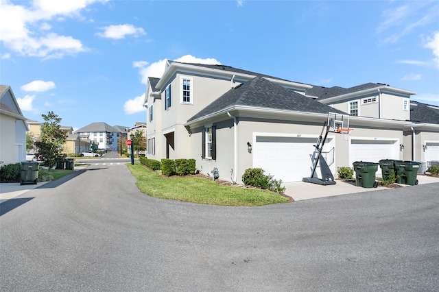 view of side of property with a garage